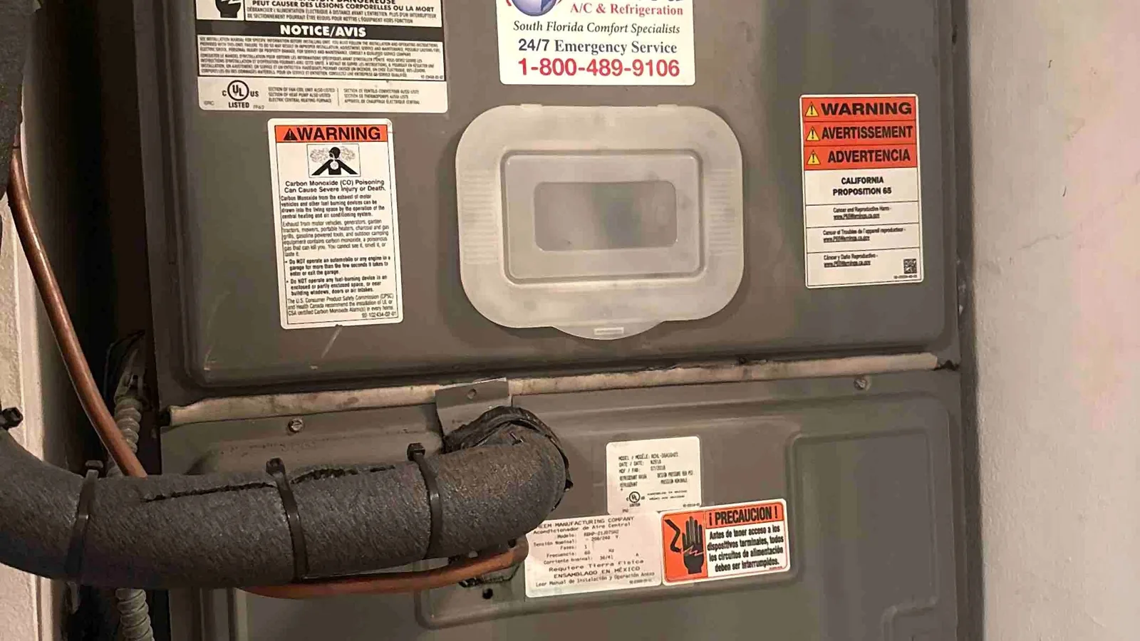 Indoor air handler in a wall alcove with insulated refrigerant line and condensate safety switch