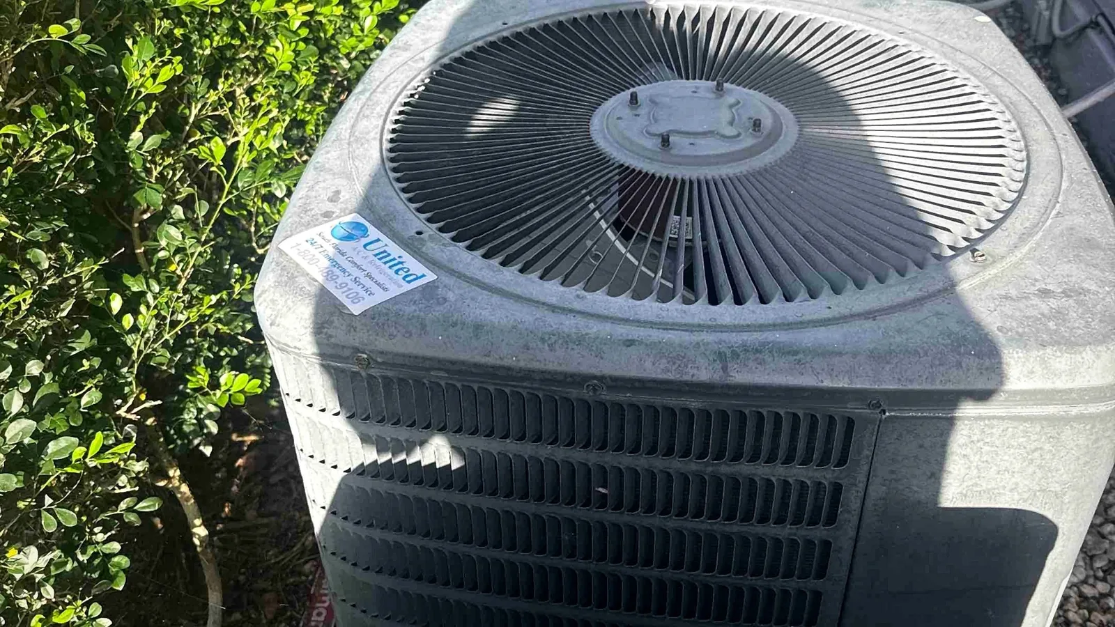 Row of condenser units in a service alley at a multi-family property