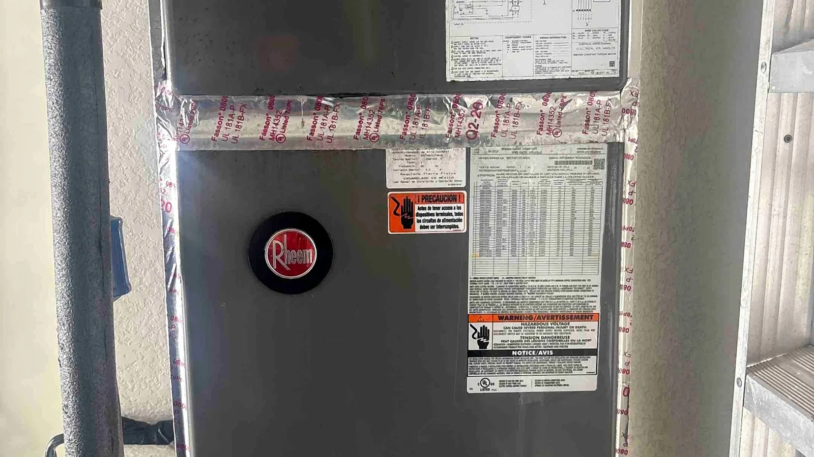 Air handler with freshly sealed plenum joints and a condensate safety float switch