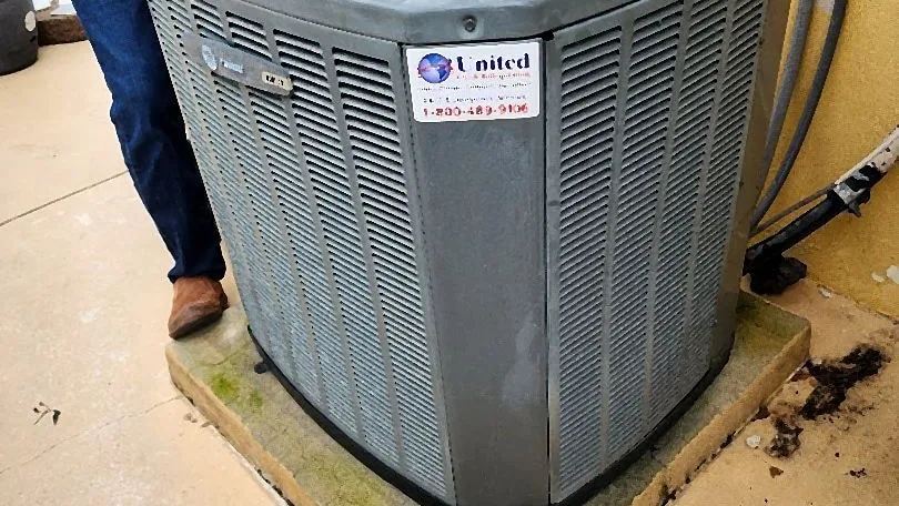 Condenser opened for service with a cordless drill and removed panel on the cabinet