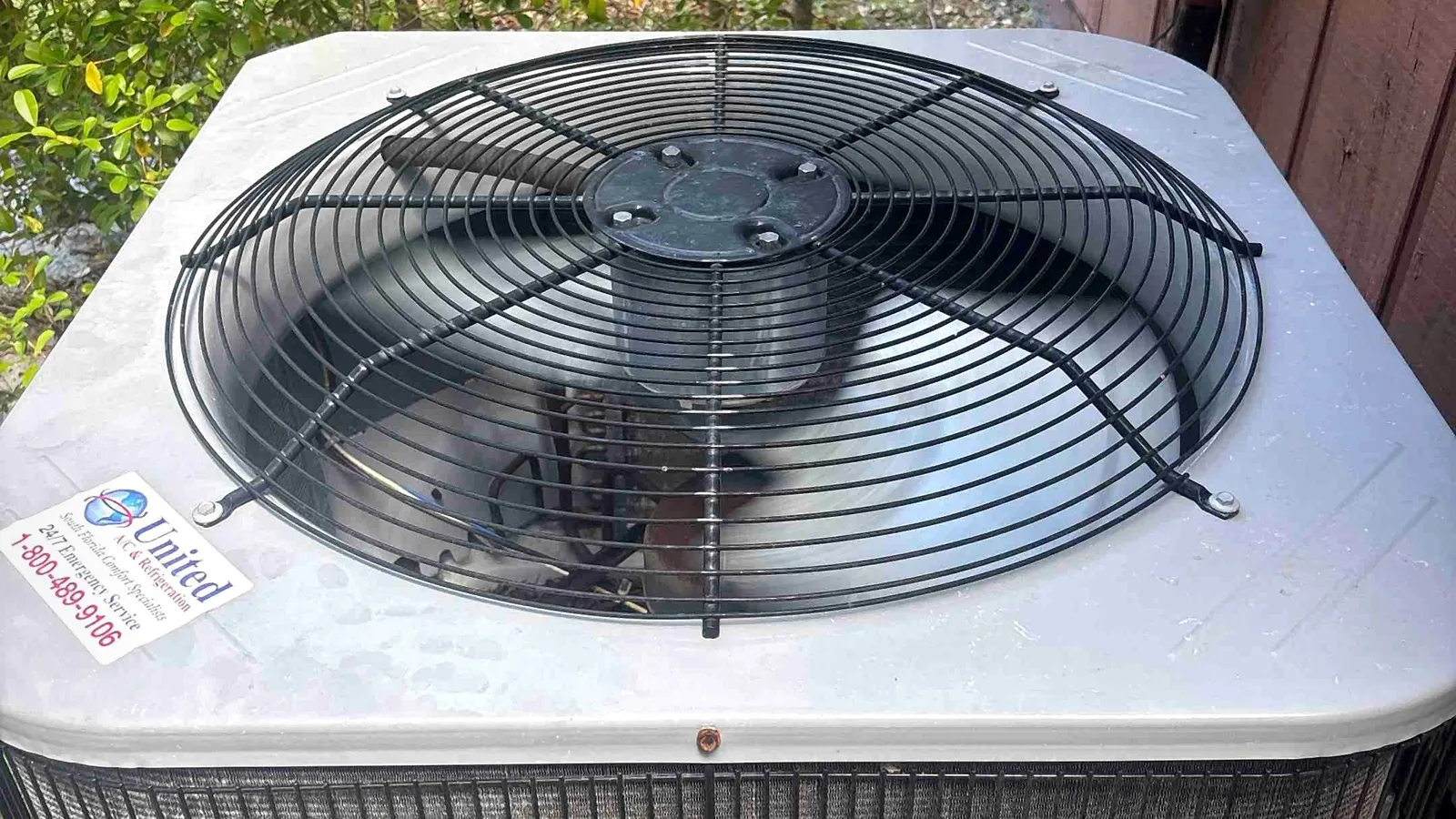 Overhead view of an outdoor condenser fan grille and coil