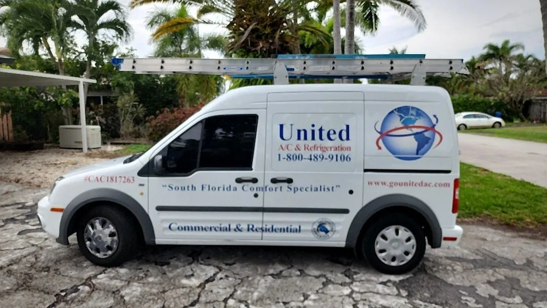 United A/C and Refrigeration service van with ladder rack at a residential job