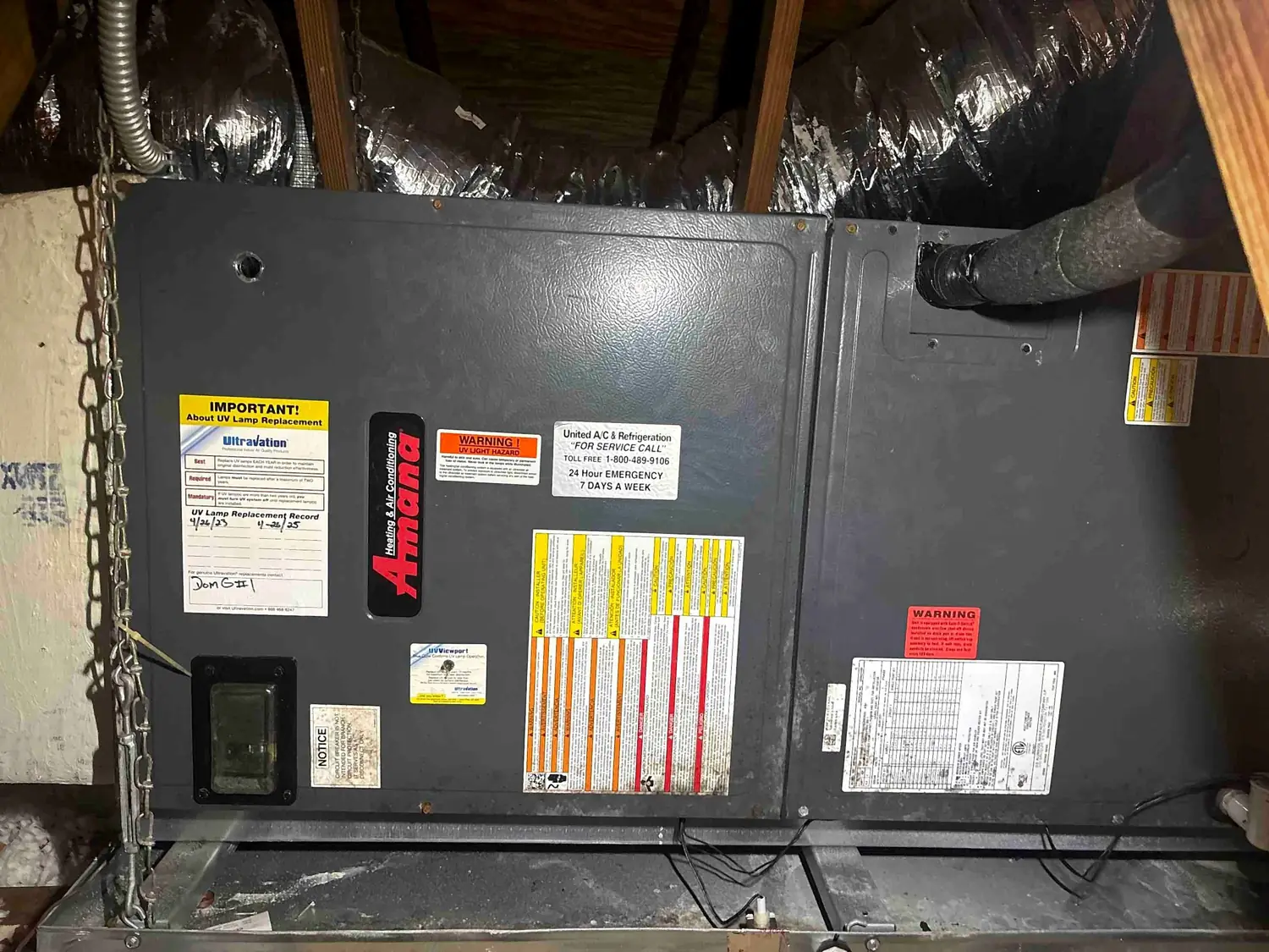 Horizontal Amana attic air handler with UV lamp air purification and service record card